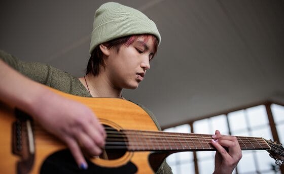 Student with a guitar
