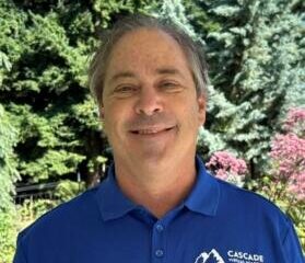 Staff photo of a white man wearing a blue CVA shirt. This is Brian Blanton.