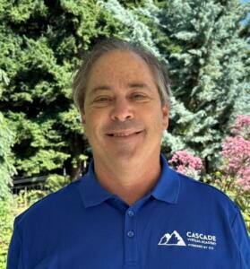 Staff photo of a white man wearing a blue CVA shirt. This is Brian Blanton.